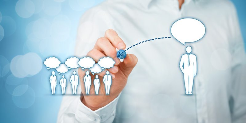 Someone showing effective communication by drawing others with thought bubbles